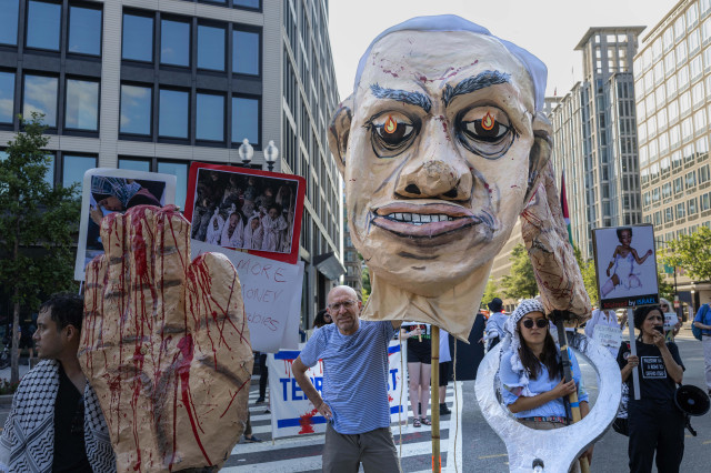 UngrupodemanifestantesprotestanporelgenocidioenGazaconimgenesdeNetanyahu